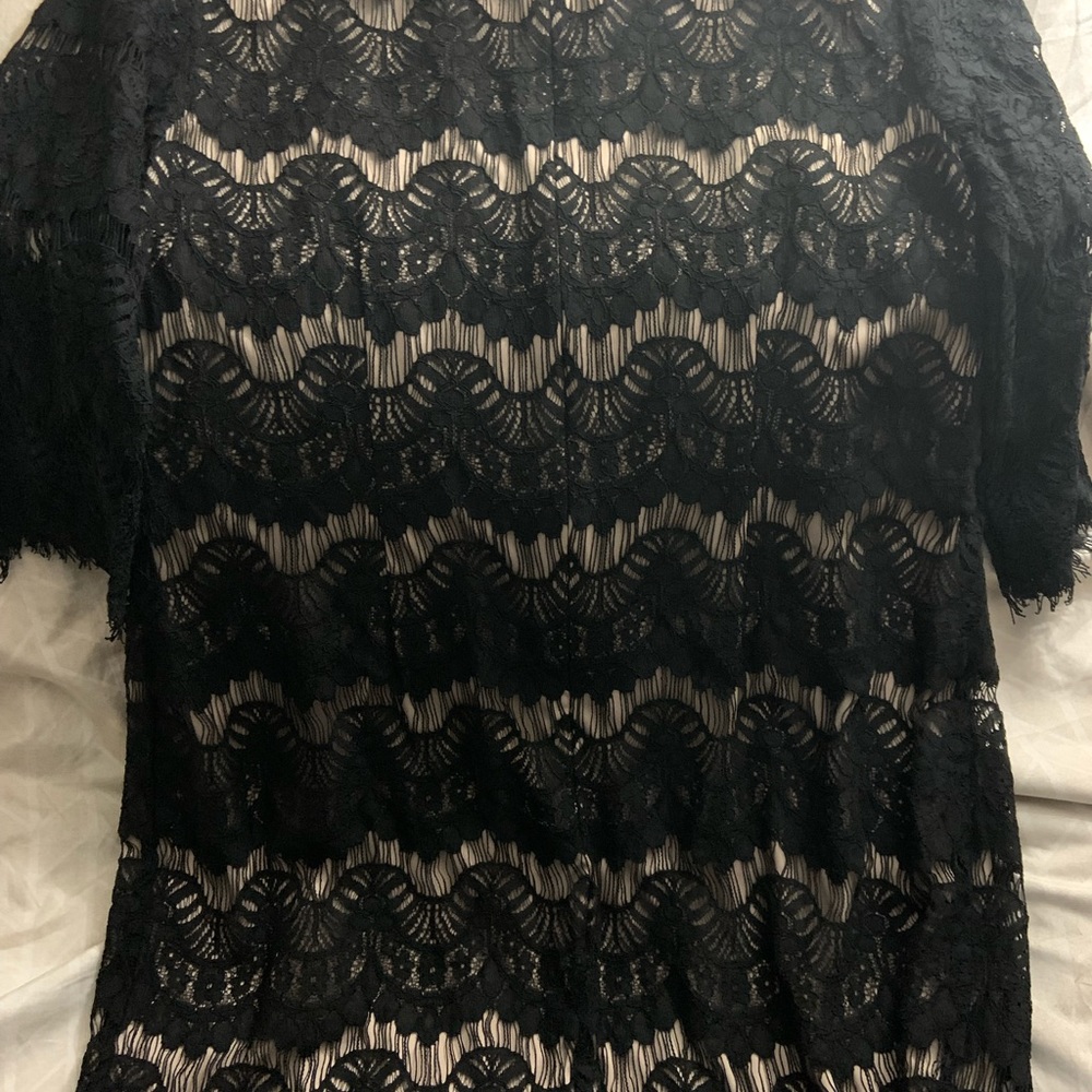 Dark blue laced dress with beige lining